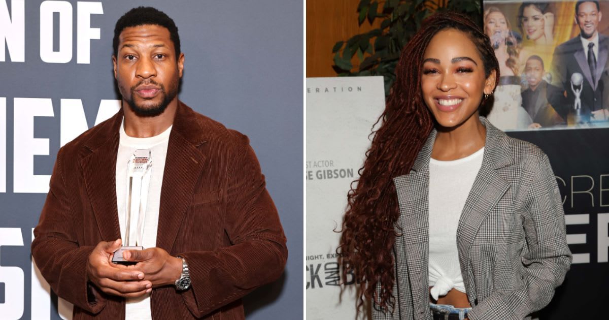 Jonathan Majors and Meagan Good stand with each other during his assault trial (Getty Images)