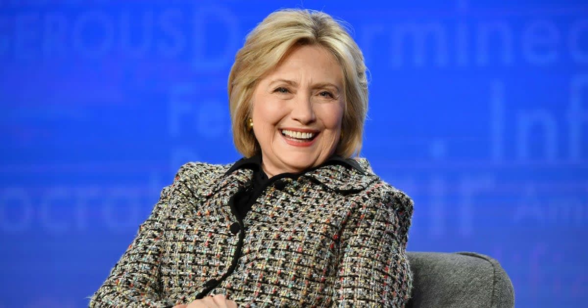 The photos capture Hillary clutching a copy of 'Shanda: A Memoir of Shame and Secrecy' by feminist author Letty Cottin Pogrebin (Getty Images)