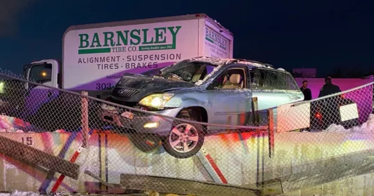 Boulder Police noted that the Lexus SUV was 'precariously' hanging off the embankment wall after the crash (Boulder Police Department)