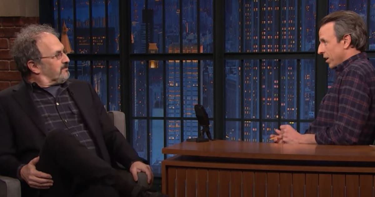 Seth Meyers and Robert Smigel engaged in a lighthearted exchange, blending camaraderie and humor (Late Night with Seth Meyers)