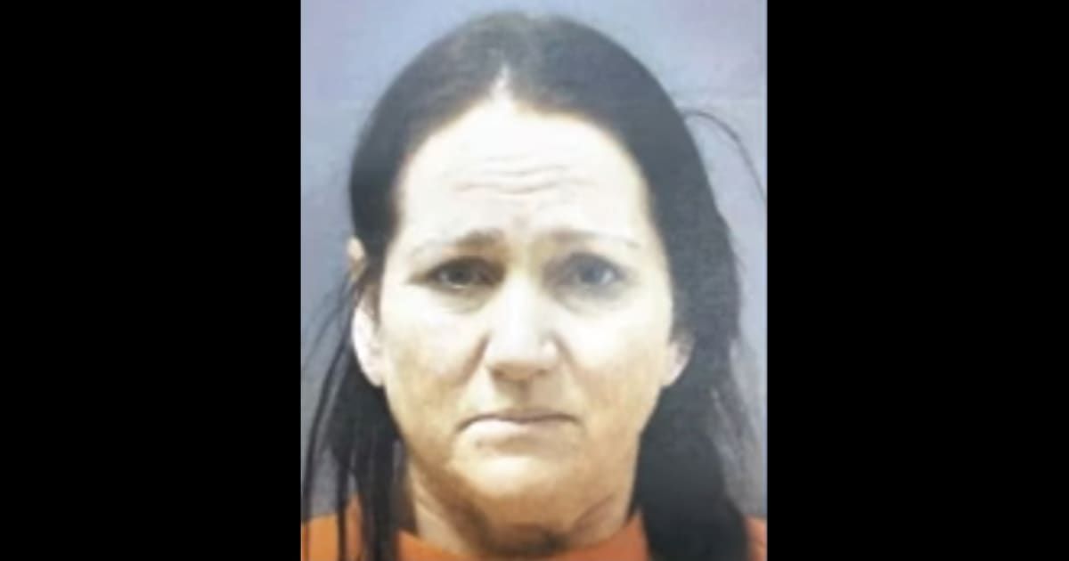 Karina S Cooper was taken into custody and charged with one count of first-degree premeditated murder in the 2021 slaying of Ryan Cooper (Screenshot/KCCI)