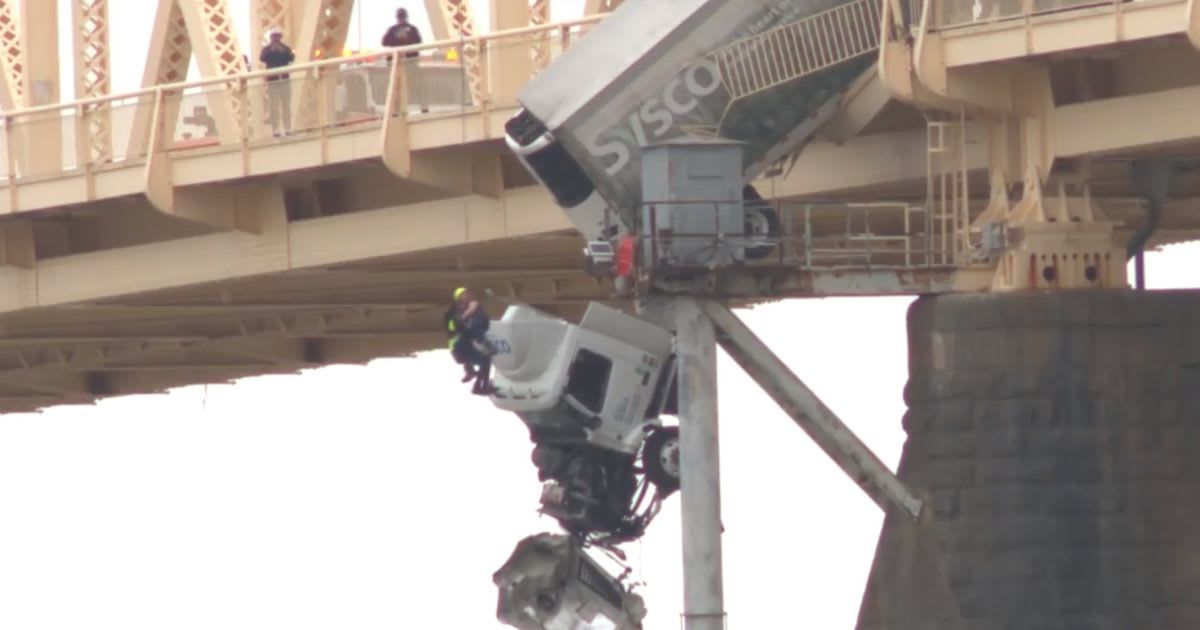 ‘Looks very scary’: Internet on tenterhooks as rescue of semi-truck driver dangling from Louisville Bridge goes viral 