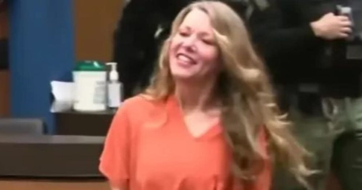 Lori Daybell was spotted grinnning from ear to ear waited for a new trial (Court TV screengrab)