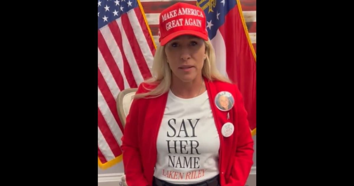 Marjorie Taylor Greene attends=ed the SOTU address donning a MAGA hat and shirt with Laken Riley's name on it (@repmtg/Instagram)