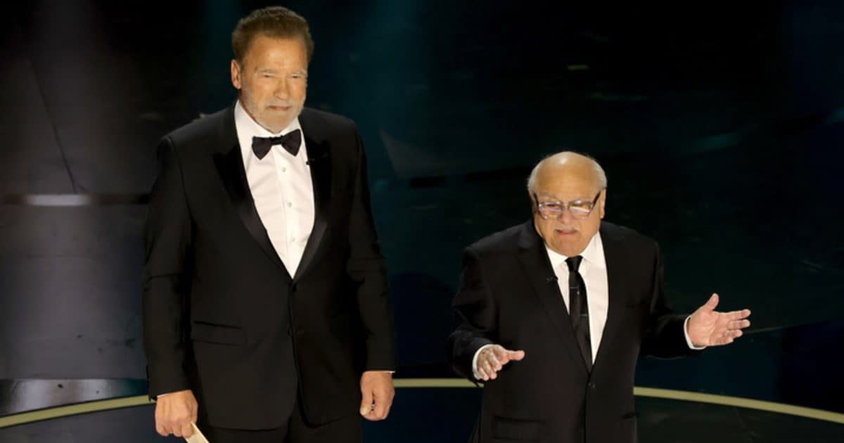 (L-R) Arnold Schwarzenegger and Danny DeVito speak onstage during the 96th Annual Academy Awards at Dolby Theatre on March 10, 2024 in Hollywood, California (Kevin Winter/Getty Images)