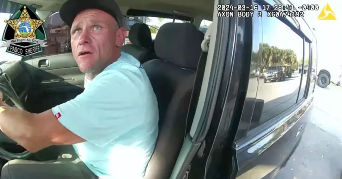 Paul Smith tried to take off as Deputy Christopher Howell clung to his car (Pasco Sheriff's Office)
