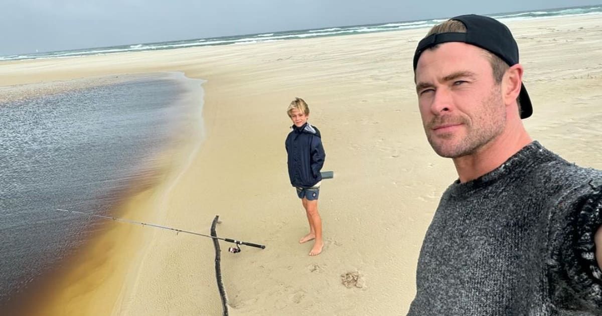 Chris Hemsworth shared a selfie of himself and his son standing on the beach during a fishing adventure (@chrishemsworth/ instagram)
