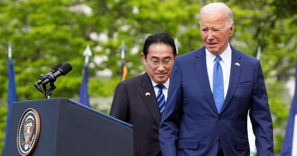 President Joe Bidenand Japanese Prime Minister Fumio Kishida walk to the podium during an arrival ceremony at the White House (Andrew Harnik/Getty Images)