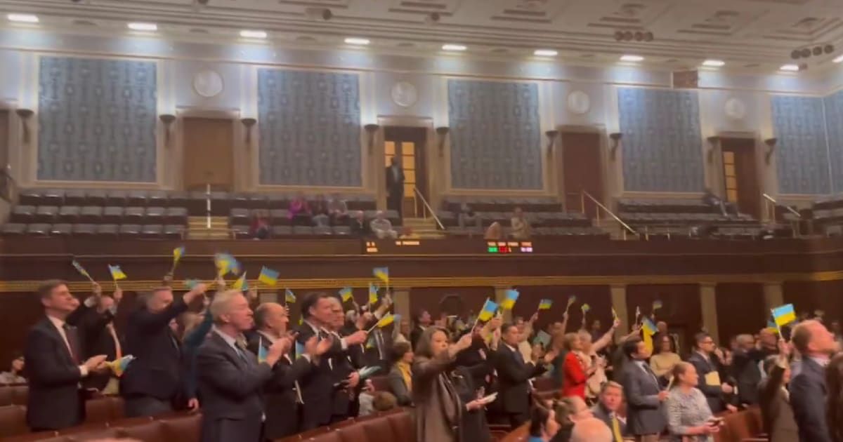 House Democrats waiving the Ukrainian flag (@RepThomasMassie/X)