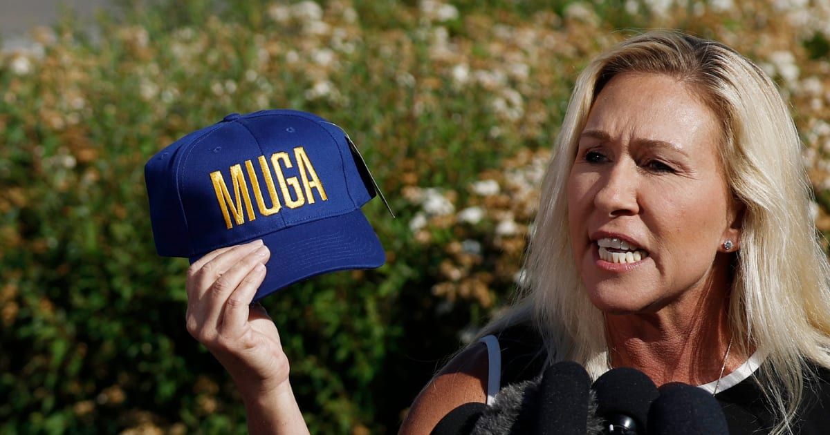 Marjorie Taylor Greene displayed the blue and yellow 'MUGA' hat, a play on Trump's famous 'Make America Great Again' (MAGA) slogan (Anna Moneymaker/Getty Images)