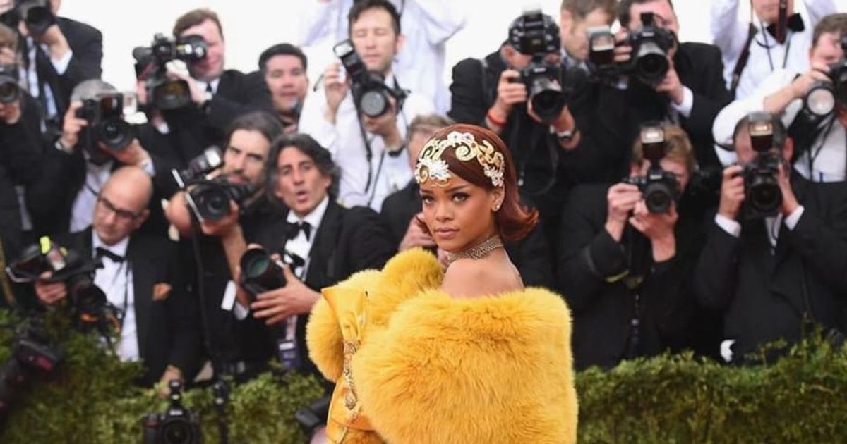 Rihana wearing a yellow fur cape for the 2018 Met Gala (Instagram/@themetgalaofficial)