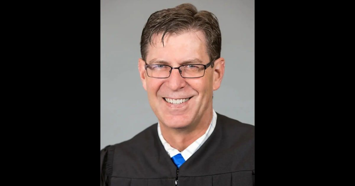 Associate District Judge Brian Lovell was already charged in two incidents in Texas when he was indicted for a drive-by shooting in his home state (Garfield County Courts)