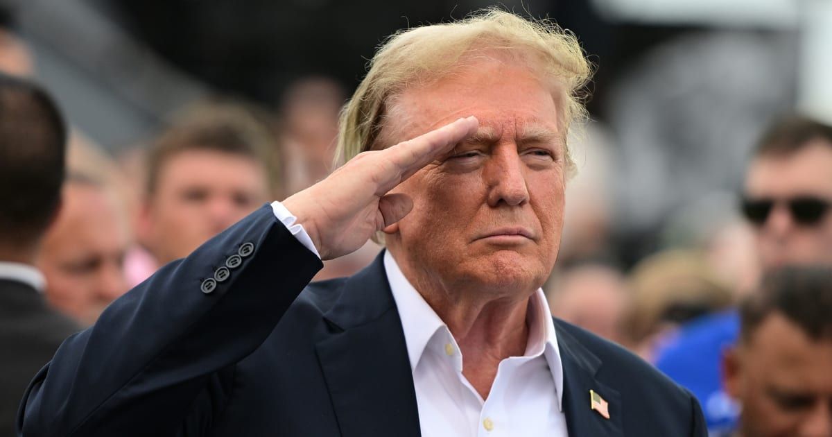 Donald Trump saluted as a Christian hymn played at the Coca-Cola 600 NASCAR race (Logan Riely/Getty Images)