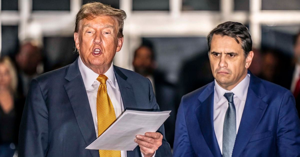 Donald Trump speaks to the media with attorney Todd Blanche (R) at the end of the day in his hush money trial at Manhattan Criminal Court on May 21, 2024, in New York City (Getty Images)