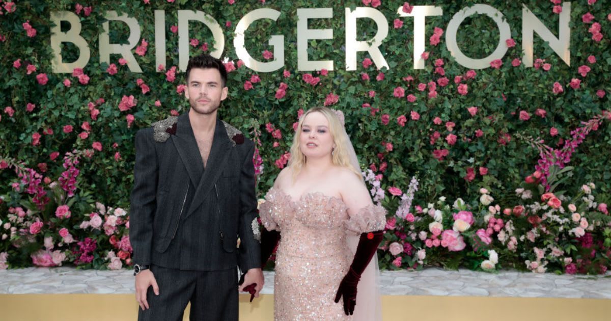 Luke Newton and Nicola Coughlan hold hands as they attend the special screening of 'Bridgerton' Season 3 - Part Two at Odeon Luxe Leicester Square on June 12, in London, England (John Phillips/Getty Images)