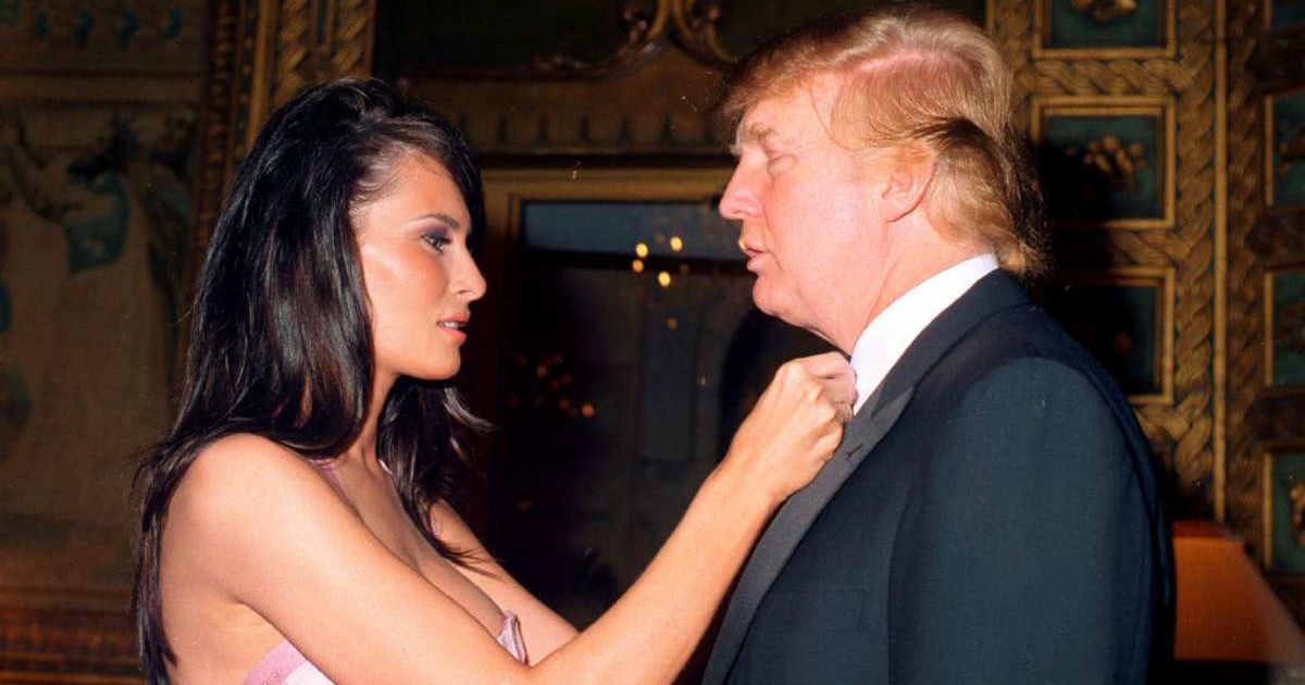 Melania Knauss adjusts bowtie of (her future husband) Donald Trump during New Year's party in 2002 (Davidoff Studios Photography/Getty Images)