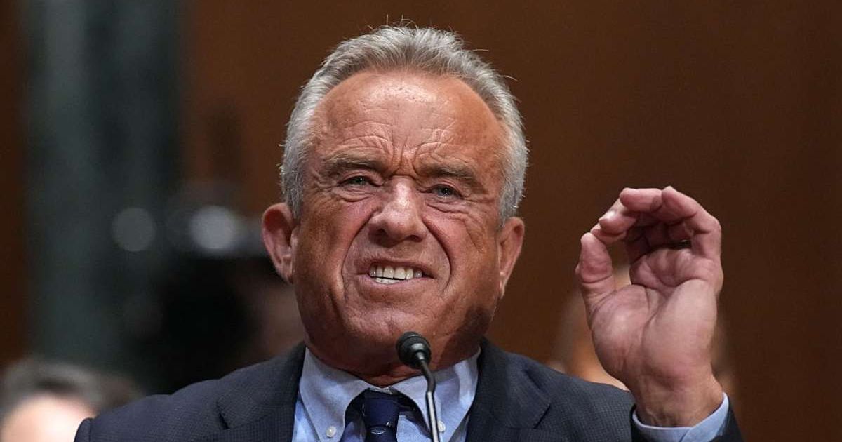 RFK Jr brutally mocked for his overly tanned look at Senate hearing: ‘Microwaved Mel Gibson’