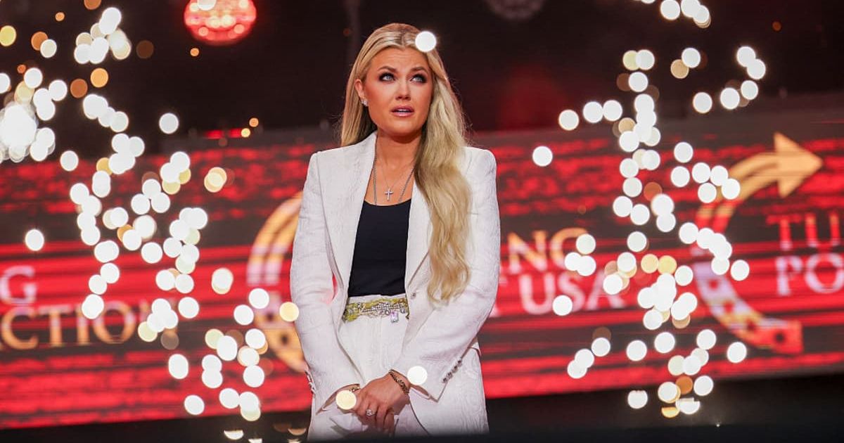 Erika Kirk spoke in white attire during the memorial service for Charlie Kirk at State Farm Stadium in Glendale, Arizona (Win McNamee/Getty Images)