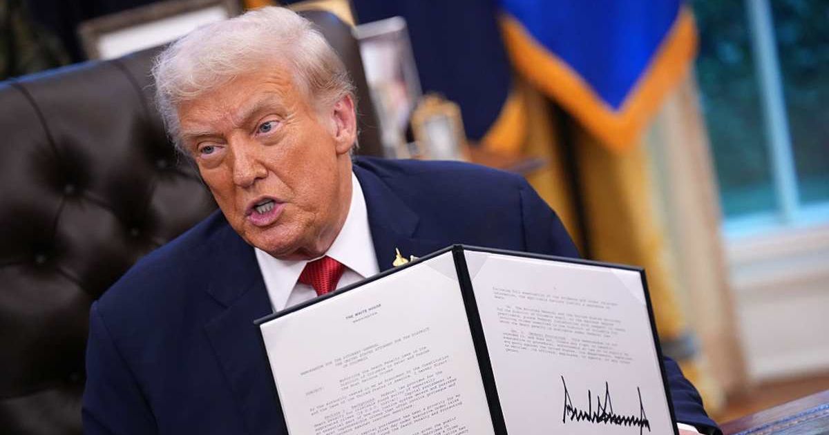 US President Donald Trump displays a signed executive order mandating the death penalty in the District of Columbia in the Oval Office of the White House on September 25, 2025 in Washington, DC (Getty Images)