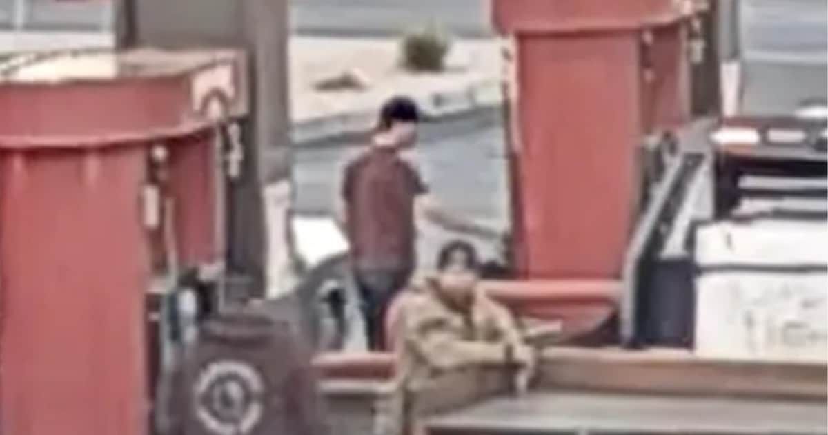 In the video, Tyler Robinson is seen wearing a maroon-colored shirt and a dark-colored hat, filling up his vehicle with gas and driving away (Screengrab/Cedar City Police)