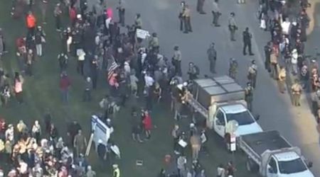 ICE agents ‘boxed in by 10 cars’ amid escalating tensions in Chicago suburb