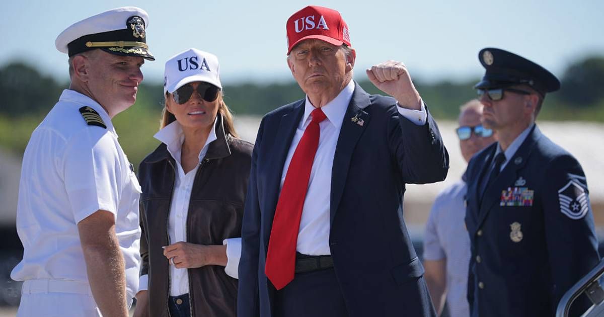 First lady Melania Trump and President Donald Trump disembark from Air Force One after landing at Naval Station Norfolk before they visit the USS George HW Bush aircraft carrier on October 5, 2025 in Norfolk, Virginia (Getty Images)