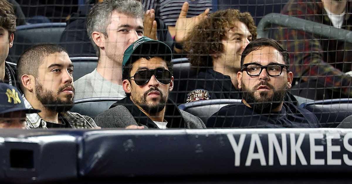 Bad Bunny stayed seated during 'God Bless America' at Yankee Stadium as fans around him stood and sang (Getty Images)