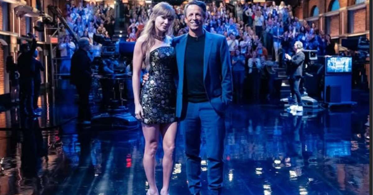 Taylor Swift posed with Seth Meyers in a floral corset dress and golden sandals (@sethmeyers/Instagram)