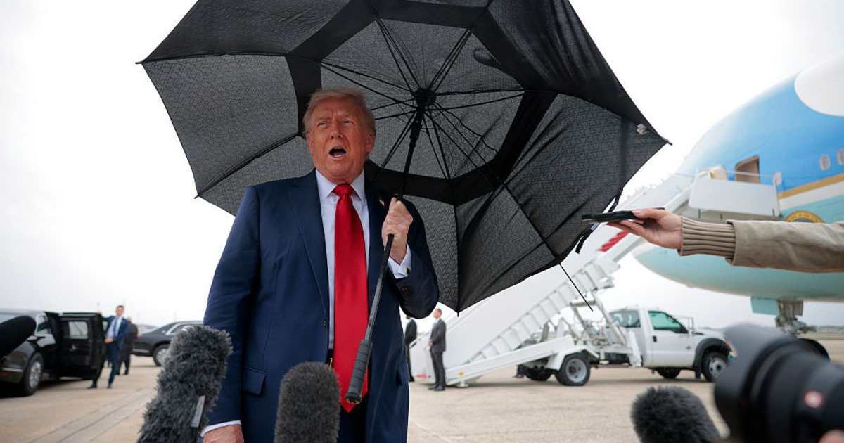 President Donald Trump speaks to the press before boarding Air Force One for a trip to the Middle East on October 12, 2025 at Joint Base Andrews, Maryland (Chip Somodevilla/Getty Images)