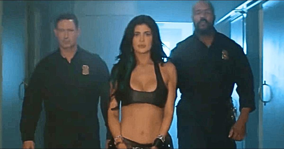 Kylie Jenner posed handcuffed between fake police officers in a promo for her 'King Kylie' collection (@kyliejenner/X)