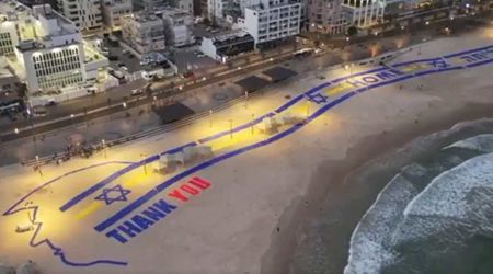 Trump greeted with huge 'Thank You' sign near Tel Aviv beach as Air Force One arrives in Israel