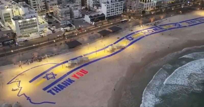 Trump greeted with huge 'Thank You' sign near Tel Aviv beach as Air Force One arrives in Israel