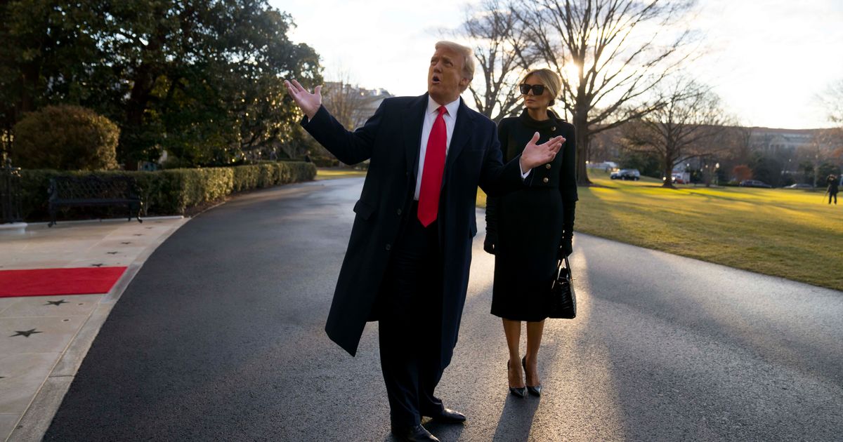 Donald Trump said his first night in the White House with Melania felt 'surreal' as they stood together outside the Lincoln Bedroom (Getty Images)
