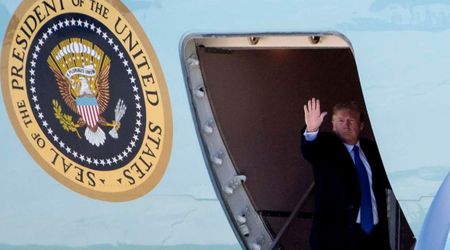 Donald Trump boards Air Force One using small stairs amid heightened security