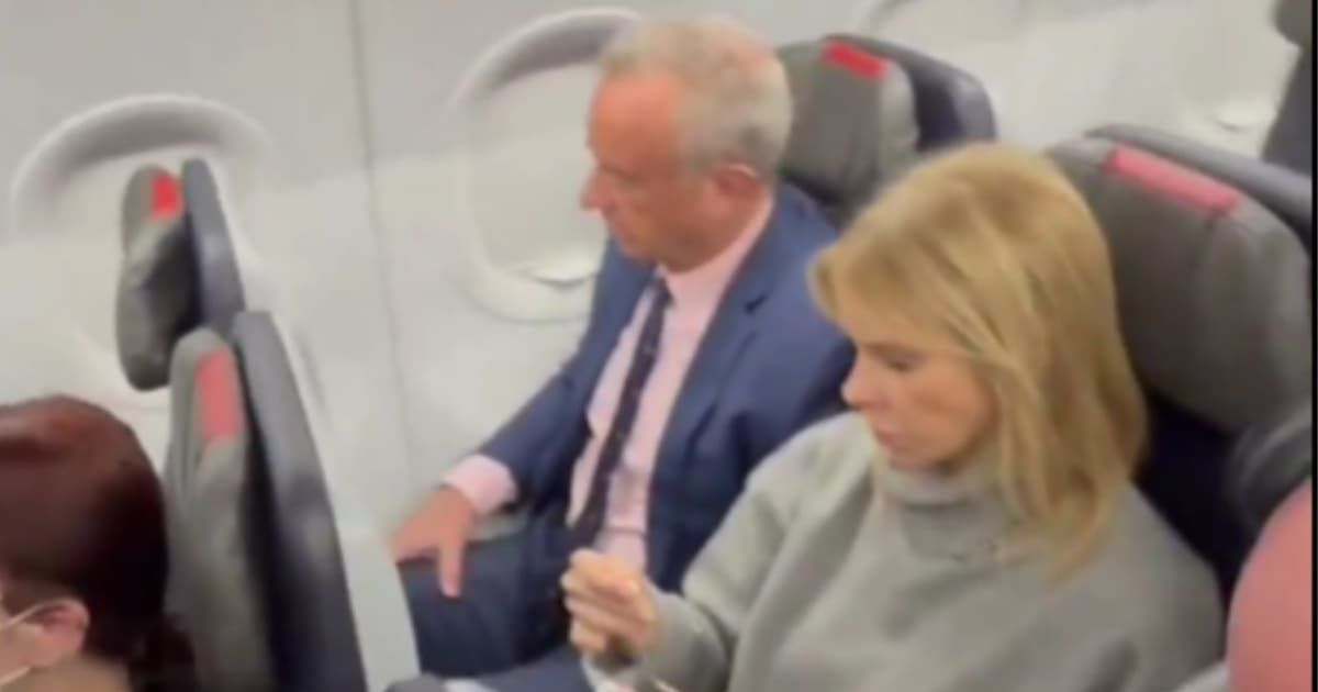 Robert F Kennedy Jr and Cheryl Hines were spotted flying in economy class on a commercial flight (@Rightanglenews/X)