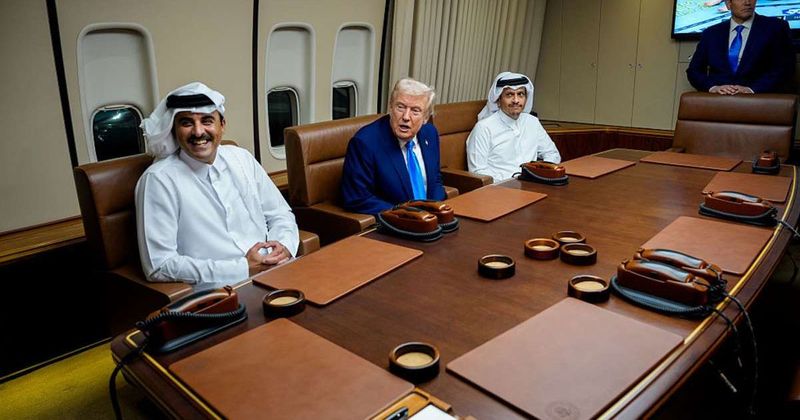 Trump greets Qatari emir aboard Air Force One during refueling stop en route to Asia