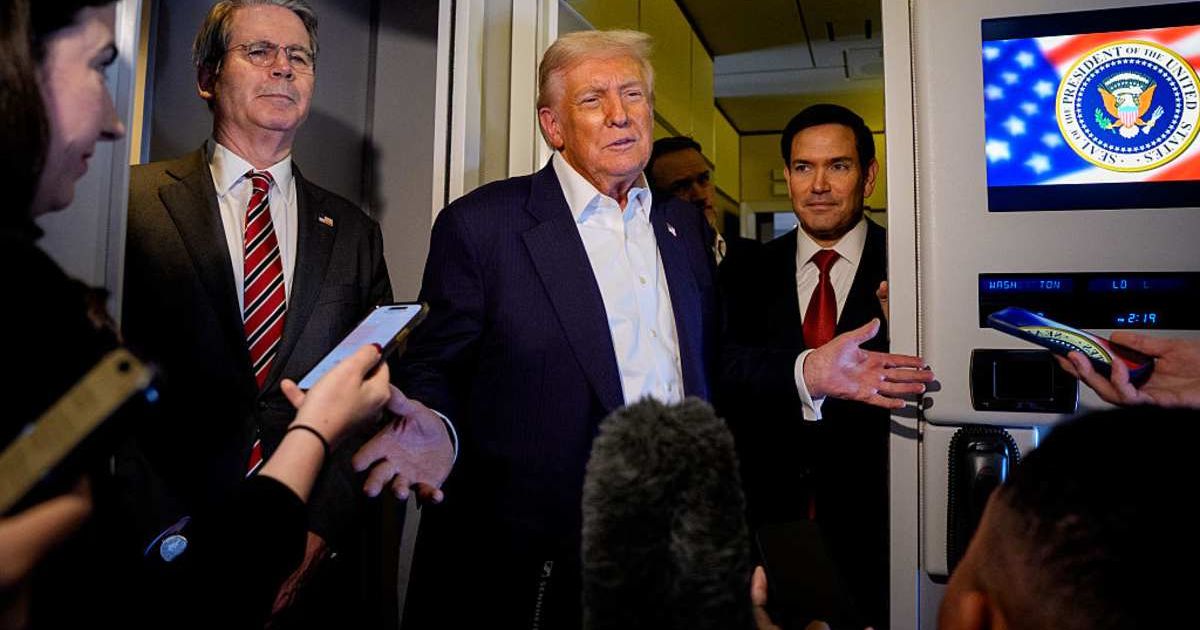 President Donald Trump spoke to reporters aboard Air Force One during his flight to Tokyo (Getty Images)