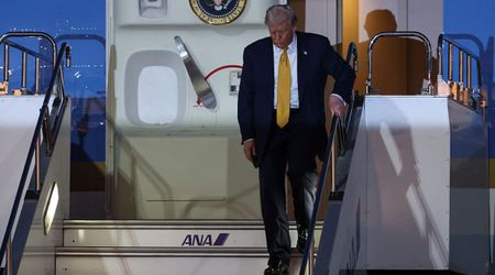 Trump, 79, appears frail as he grips handrail while stepping off Air Force One in Japan