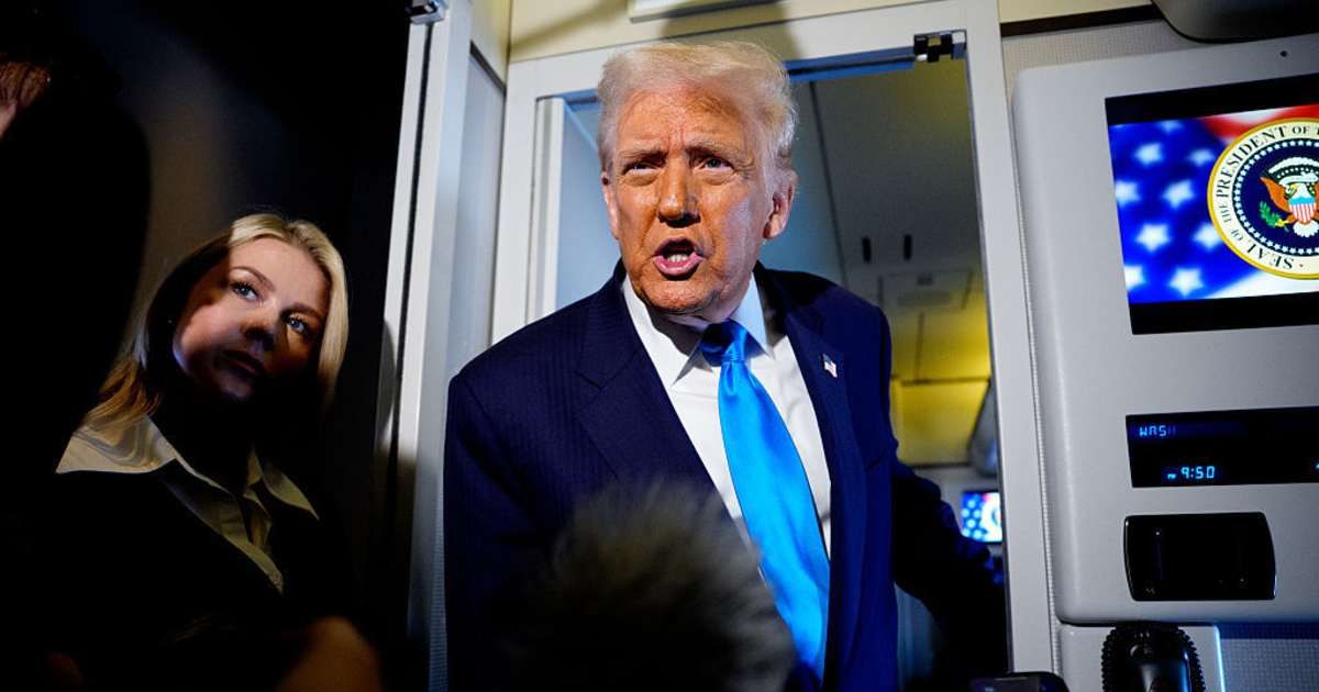 President Donald Trump speaks to journalists aboard Air Force One en route to South Korea on October 29, 2025, in Japan (Andrew Harnik/Getty Images)