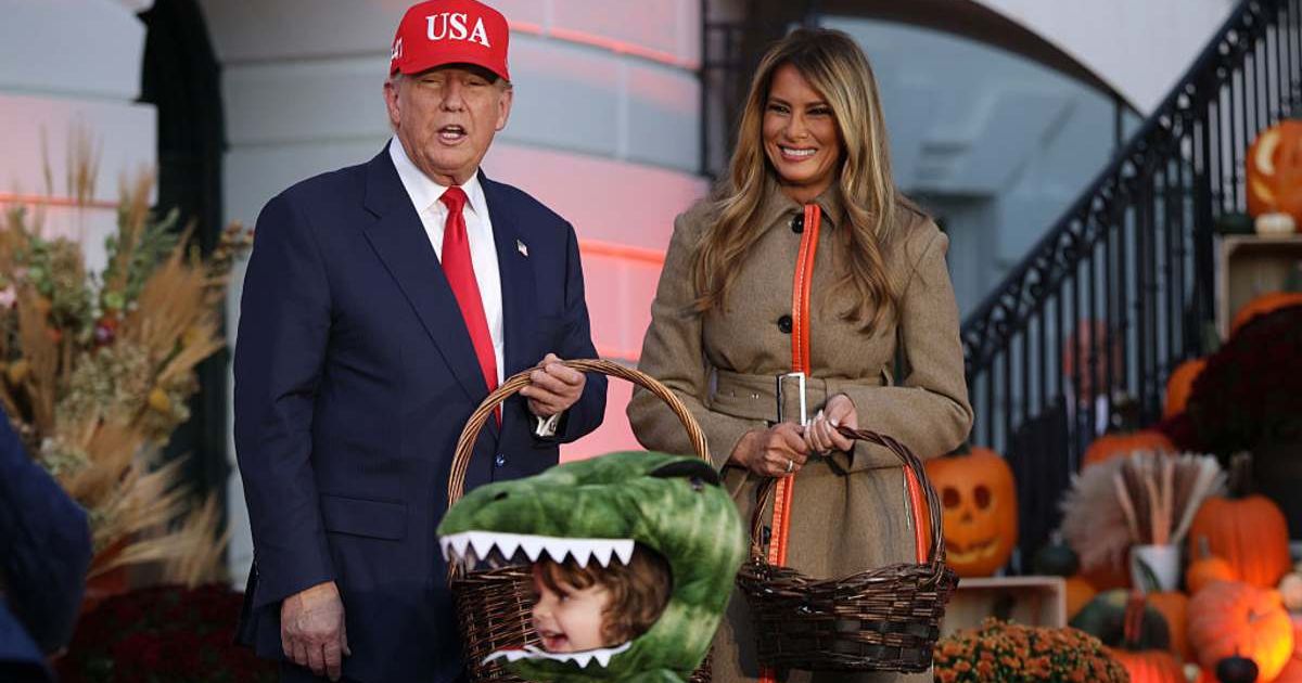 US President Donald Trump and first lady Melania Trump handout candy to children during the annual Halloween at the White House event on the South Lawn of the White House on October 30, 2025 in Washington, DC (Getty Images)