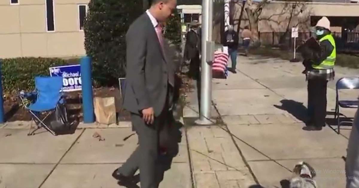 A viral video showed Jay Jones appearing to swing at a small dog outside a Virginia polling station (@KlarkeKilgore/X)