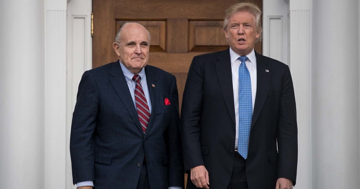 President Donald Trump granted Rudy Giuliani and 76 others 'a full, complete, and unconditional pardon' (Getty Images)