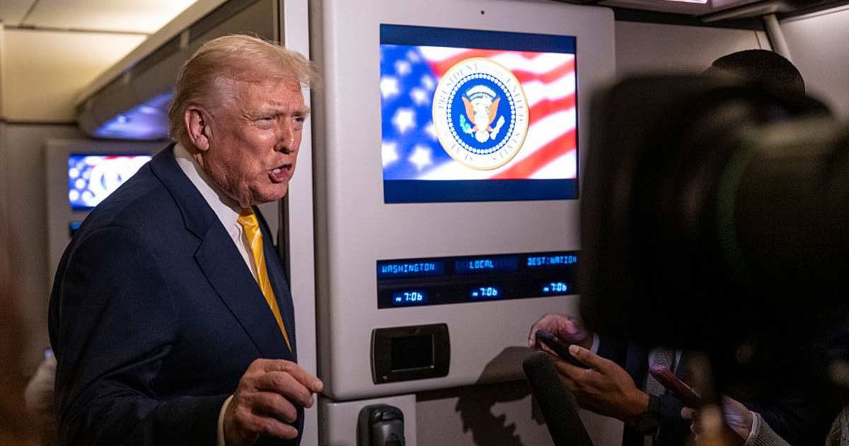President Trump addresses reporters on Air Force One regarding the dismissal of James Comey and Letitia James charges (Roberto Schmidt/Getty Images)