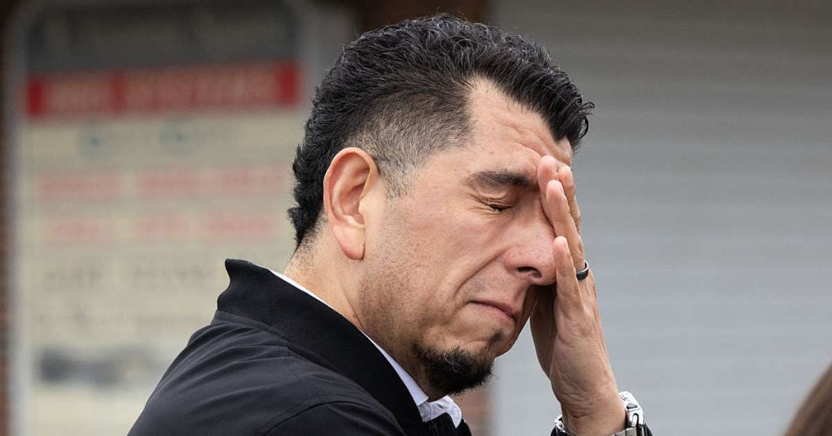 Pastor Sergio Acedo stood with a group praying near the scene of a shooting that killed four and wounded 11 on Sunday, November 30, in Stockton, California (Getty Images)