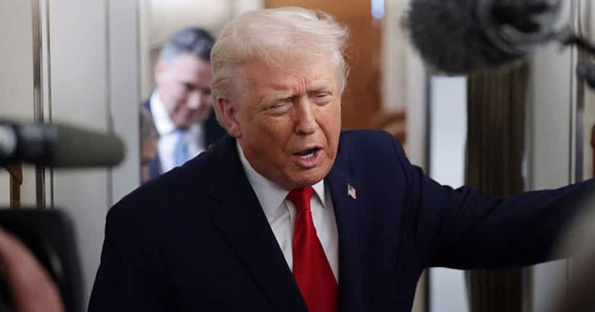 US President Donald Trump speaks to the media aboard Air Force One enroute to Pennsylvania on December 9, 2025 (Alex Wong/Getty Images)