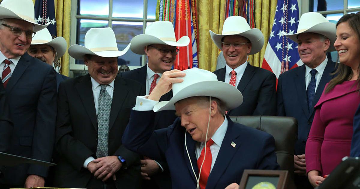 Players presented Donald Trump with a white cowboy hat replicating the ones worn before the 1980 Olympics (Getty Images)