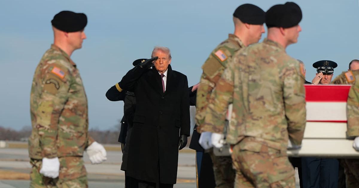 Trump salutes as a US Army carry team moves a flagged-draped transfer case containing the remains of Iowa National Guardsman Sgt. William Nathaniel Howard at Dover Air Force Base on December 17, 2025 in Dover, Delaware. (Getty Images) 