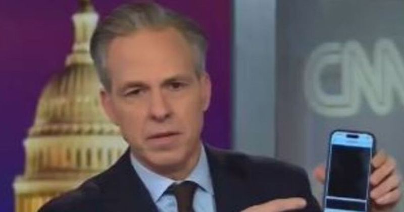 Jake Tapper shows blacked-out Epstein files on his phone: ‘100 pages of redaction’