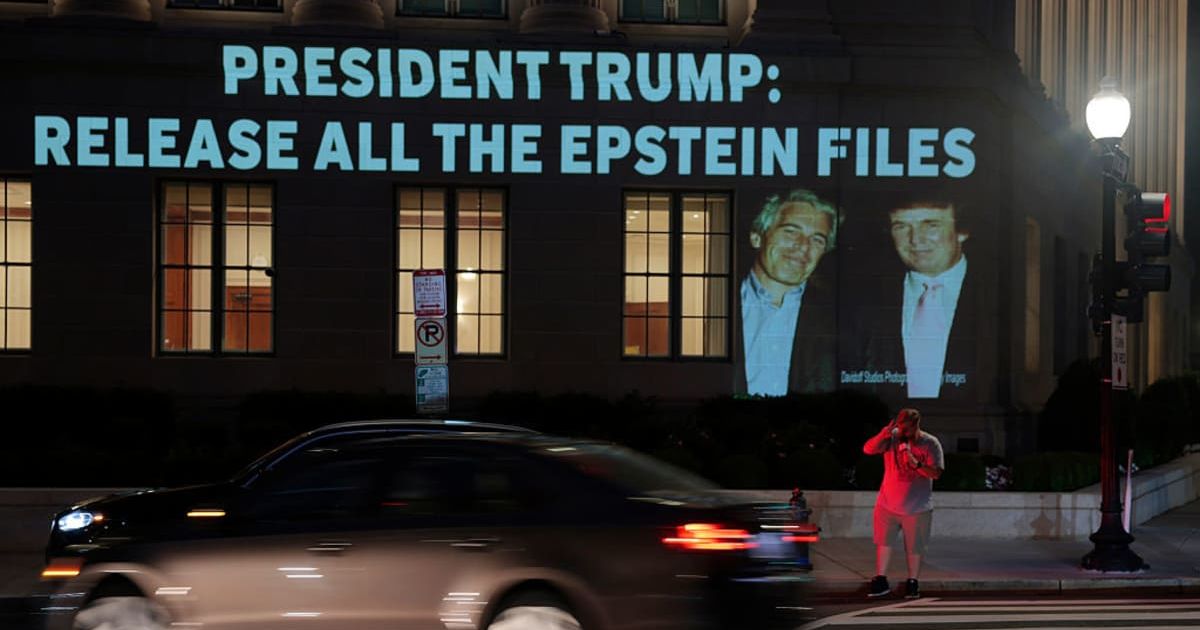 A protest image linking Donald Trump and Jeffrey Epstein was projected onto a building in Washington DC (Getty Images)