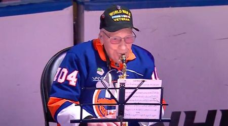 'USA!' chants erupt as WWII veteran, 104, nails National Anthem on sax before Rangers-Islanders game